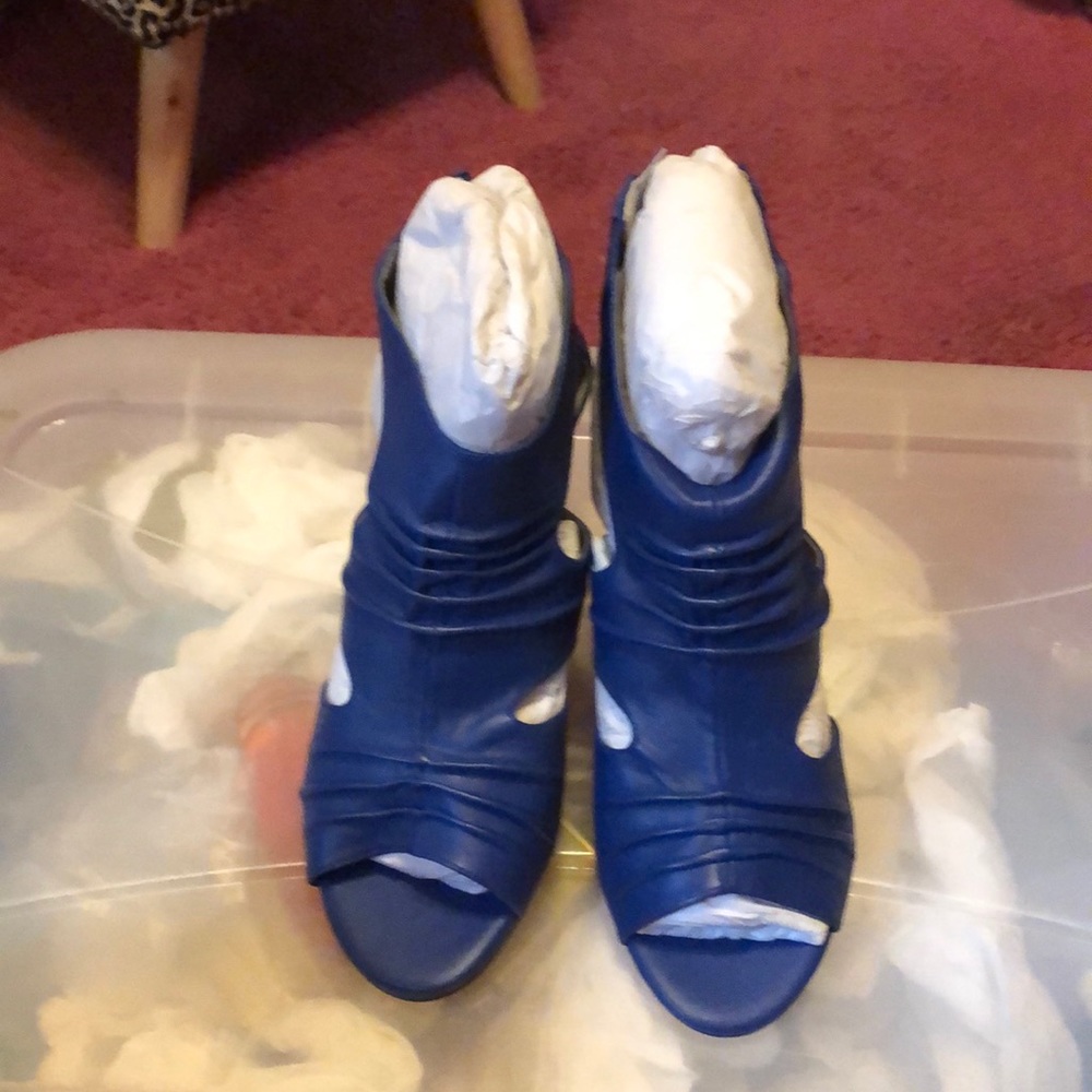 Blue ankle, open toe boots.